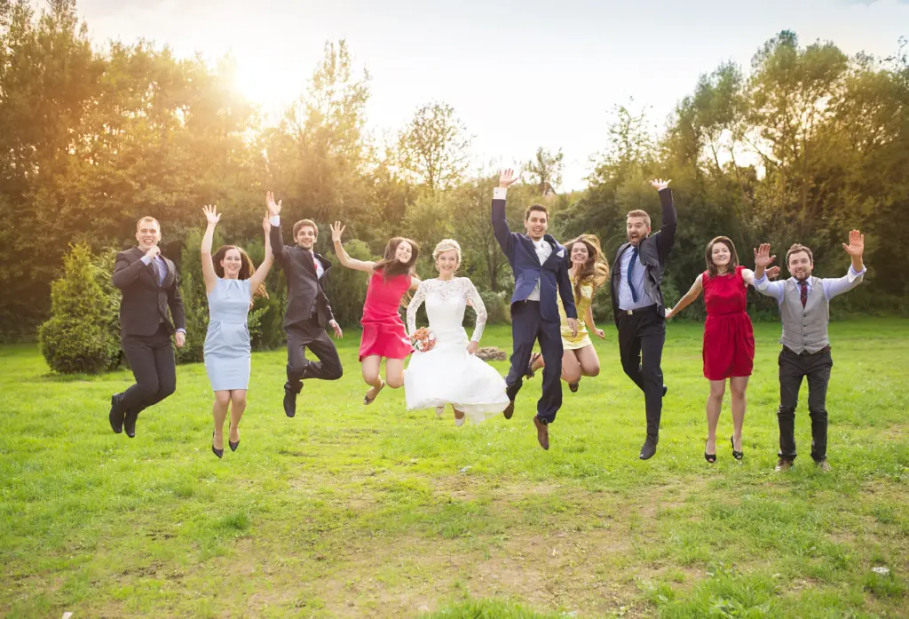 A Fun Group Jump Shot with the Bride, Groom, and Wedding Party