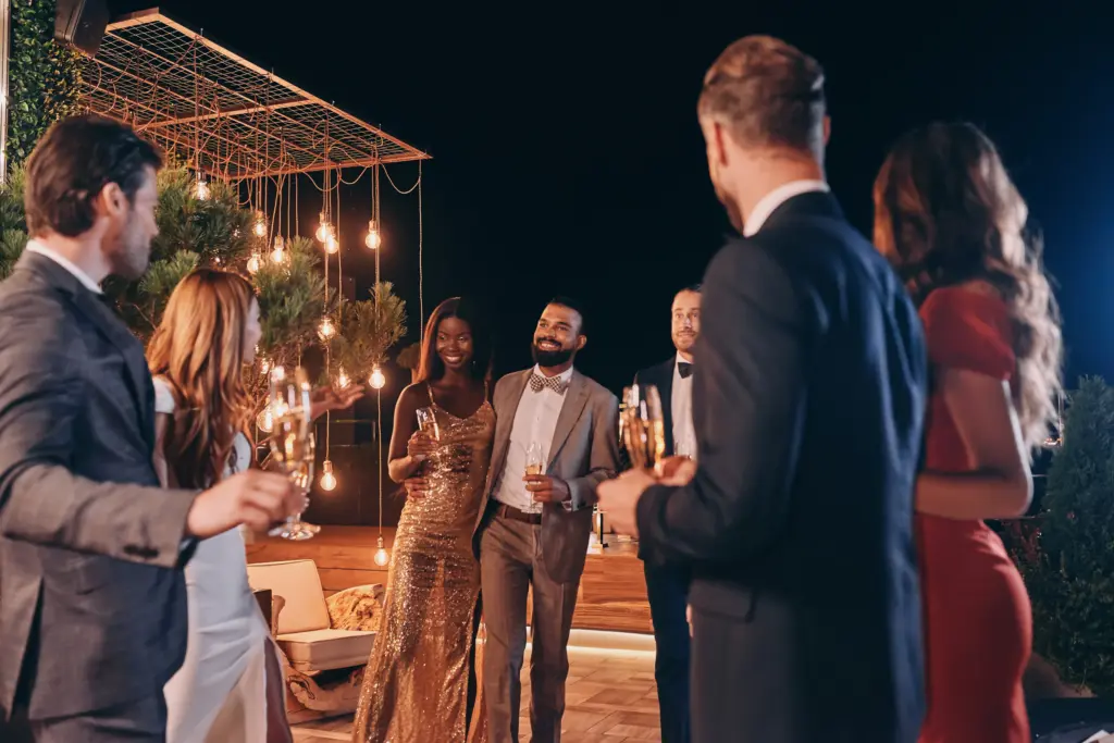 Group of beautiful people in formalwear communicating and smiling