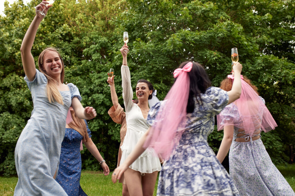 Bride-To-Be Celebrating with Her Bridesmaids in a Festive Outdoor Gathering