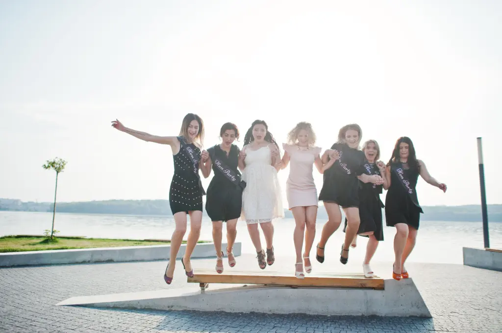 Energetic Hen Party Fun with the Bride and Her Girls Jumping Together