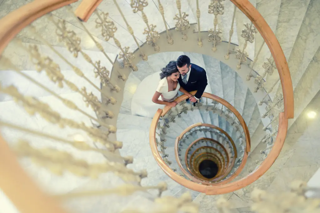 Just married couple in a spiral staircase