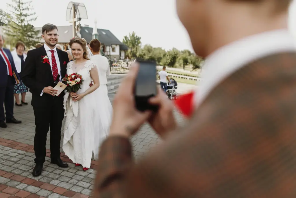 Guest Takes a Phone Snapshot of the Newlyweds Celebrating