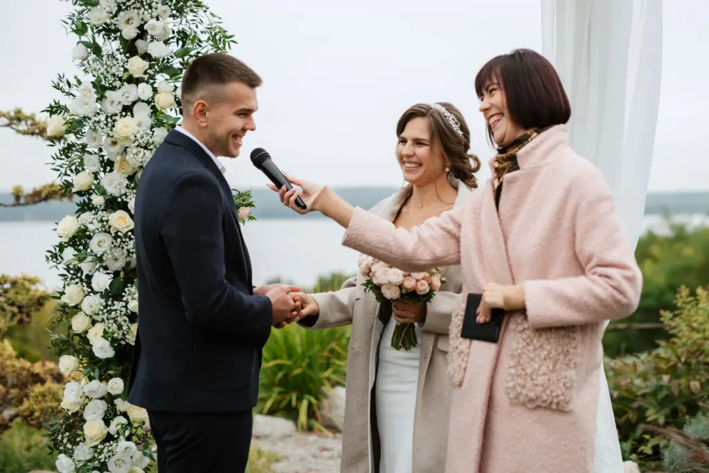 wedding ceremony of the newlyweds in a country cottage
