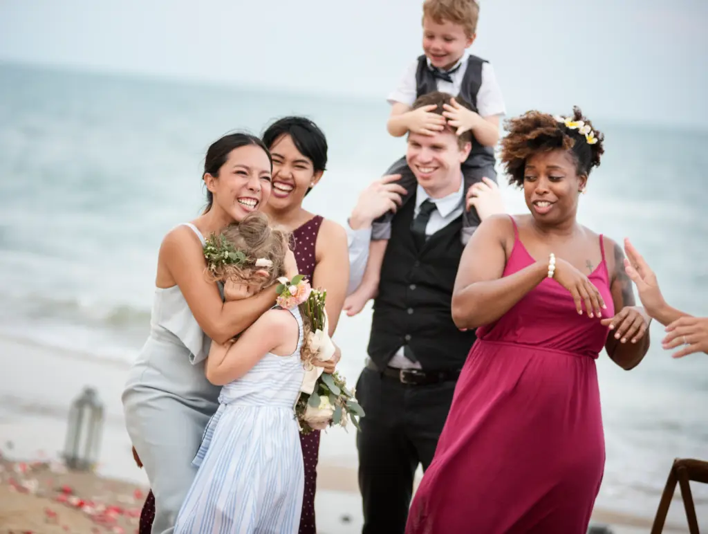 Wedding guests clapping for the bride and groom