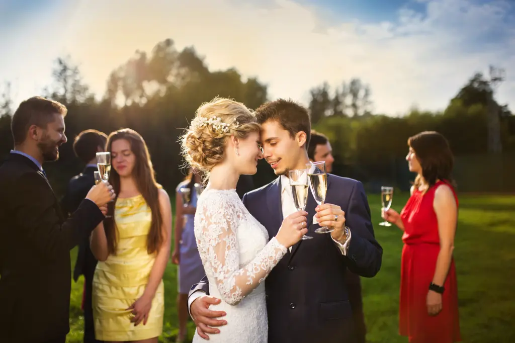 Romantic Toast by Newlyweds Outdoors